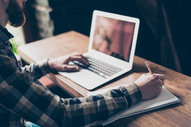 Laptop being used by a man.