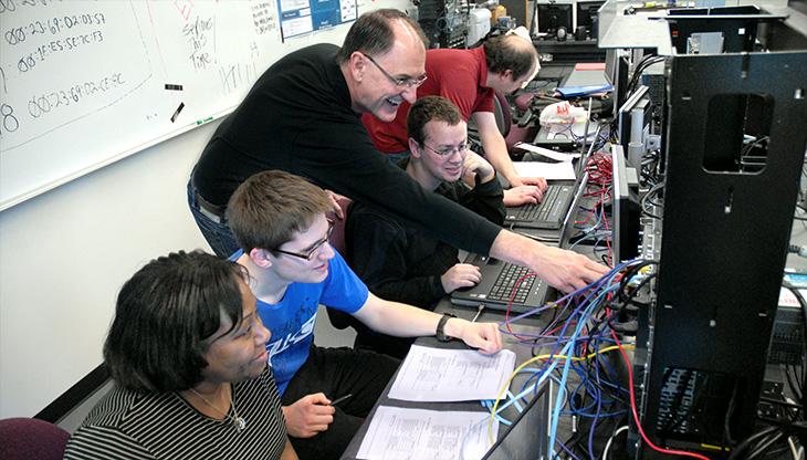 GRC Instructor Alan Carter in action teaching cybersecurity students 